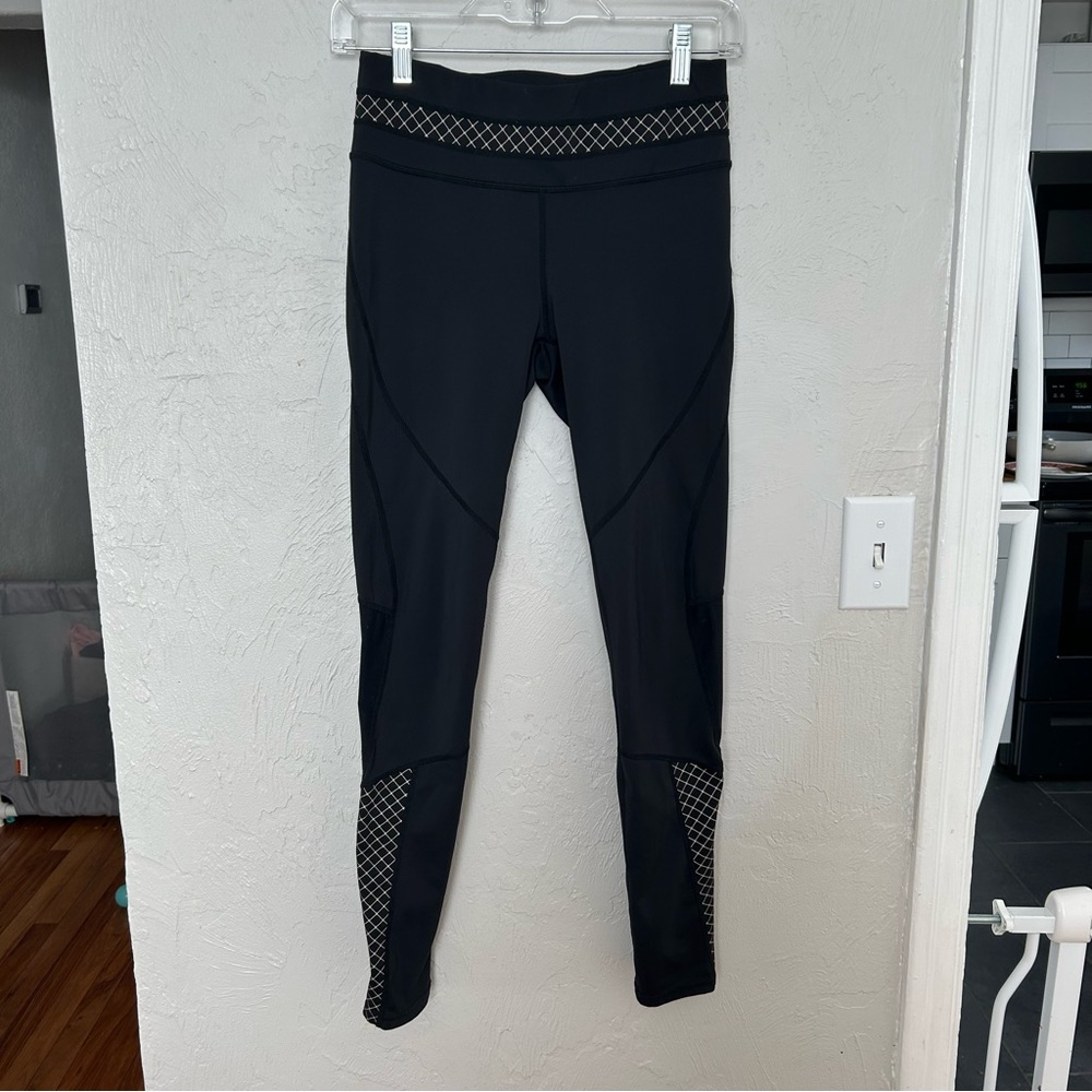Athleta (Size S) Black Leggings with Geometric Pattern and Mesh Panels